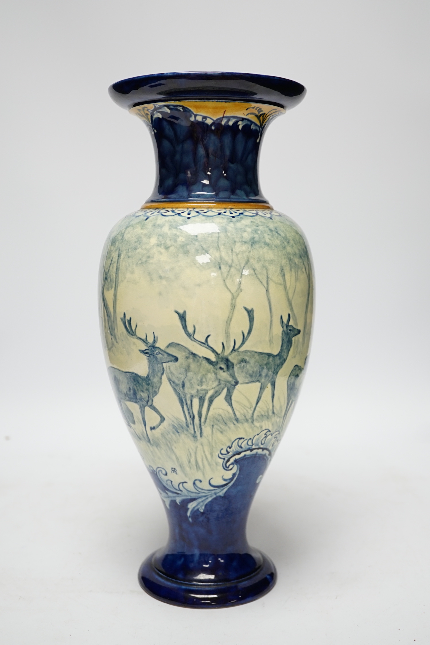 A Doulton Lambeth faience vase, c.1900, attributed to Hannah Barlow, painted with deer in woodland, monogram to the body, and to the base ‘KBS’ for Katherine B. Smallfield, 35cm, high, cf. Bonhams, Knightsbridge, London,